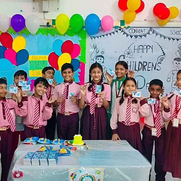 Group of school children in uniform celebrating Children’s Day with balloons, snacks, and gifts in a decorated classroom